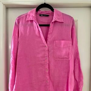 Pink linen button down shirt.